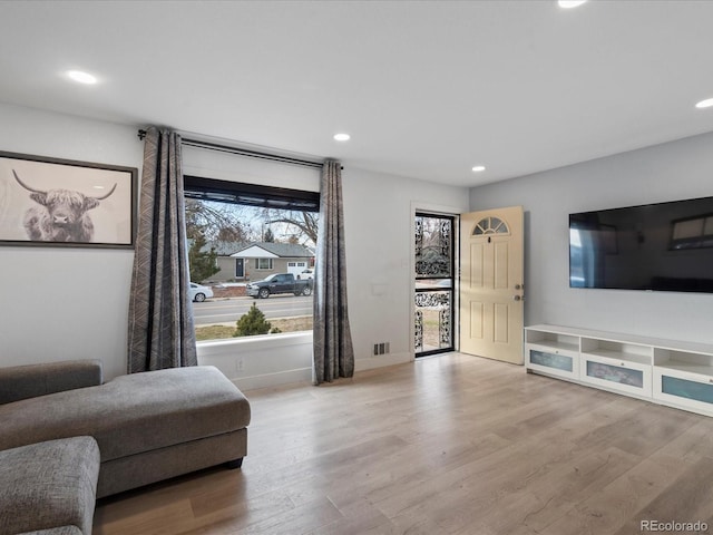 sitting room with light hardwood / wood-style floors