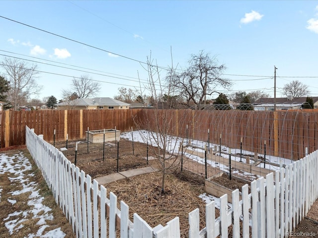 view of yard covered in snow