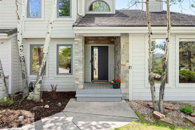 2122 Cramner Ct, Evergreen, CO 80439 - doorway to property with stone siding and a chimney