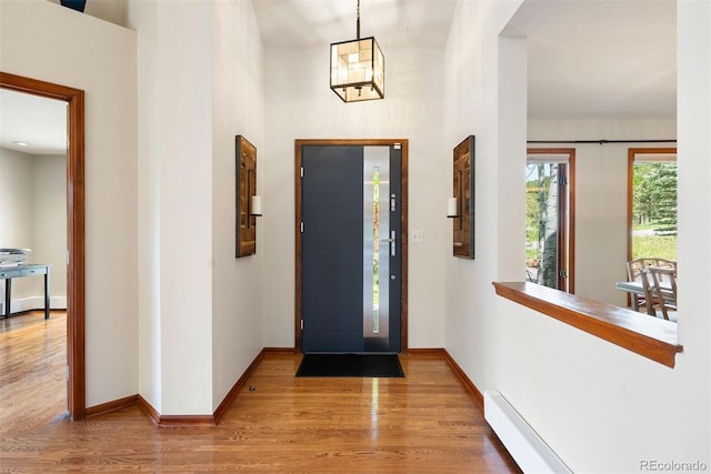 2122 Cramner Ct, Evergreen, CO 80439 - foyer featuring light wood finished floors and baseboards