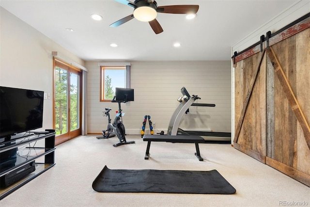2122 Cramner Ct, Evergreen, CO 80439 - workout area with carpet flooring, ceiling fan, recessed lighting, a barn door, and wood walls