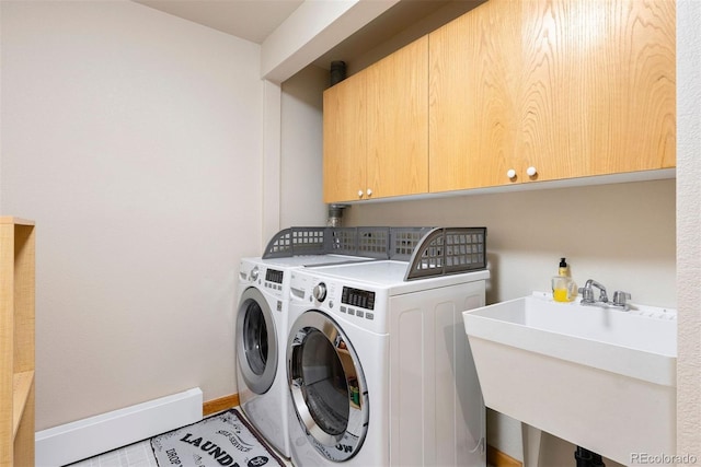 2122 Cramner Ct, Evergreen, CO 80439 - laundry area featuring cabinet space, washer and clothes dryer, and baseboards