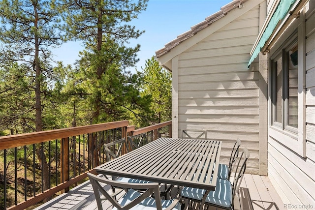 2122 Cramner Ct, Evergreen, CO 80439 - wooden terrace with outdoor dining space