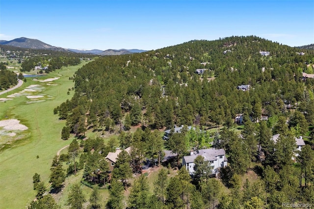 2122 Cramner Ct, Evergreen, CO 80439 - aerial view of property's location featuring a mountainous background, a golf course, and a heavily wooded area