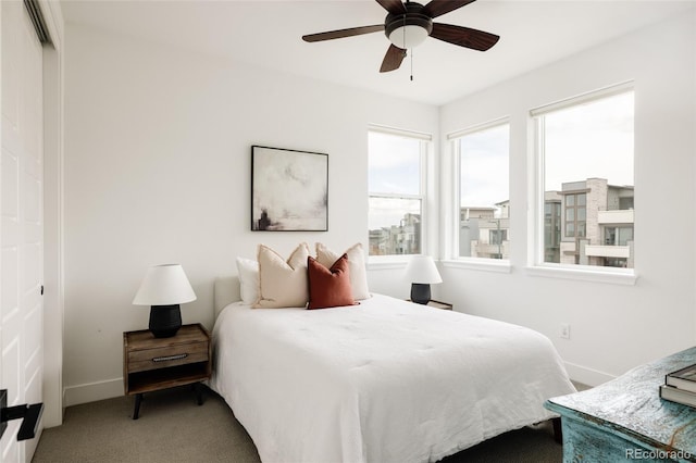 bedroom with carpet flooring, ceiling fan, and baseboards