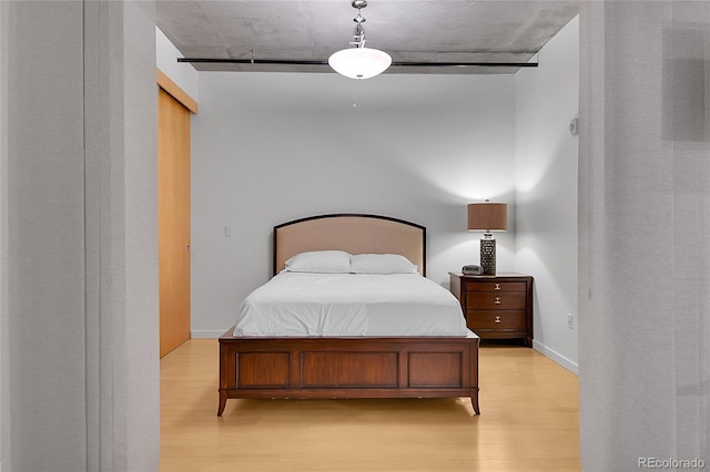 bedroom with light wood-type flooring
