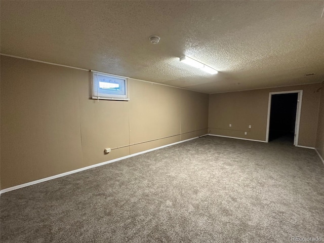 basement with a textured ceiling and carpet