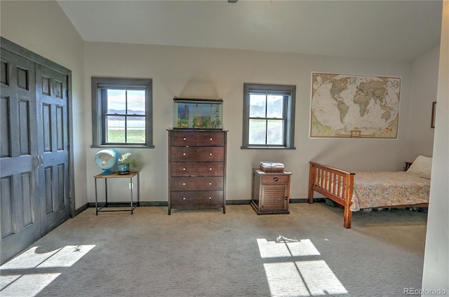 bedroom with carpet floors and baseboards