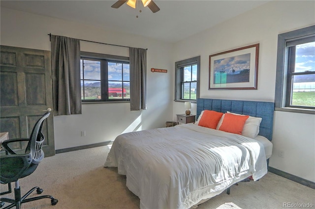 bedroom featuring carpet flooring, baseboards, and ceiling fan
