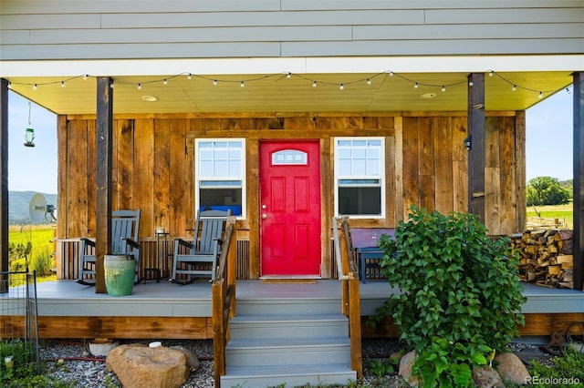 doorway to property featuring board and batten siding