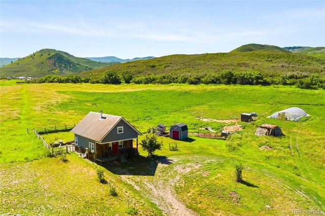 aerial view featuring a mountain view and a rural view