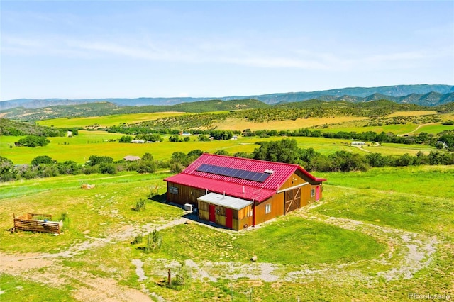 aerial view with a mountain view and a rural view