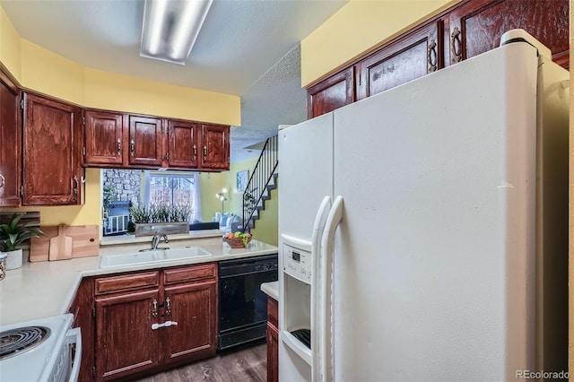 kitchen featuring a sink, black dishwasher, white fridge with ice dispenser, light countertops, and stove