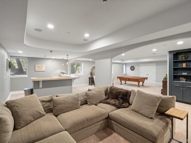 living room with arched walkways, billiards table, recessed lighting, light carpet, and baseboards