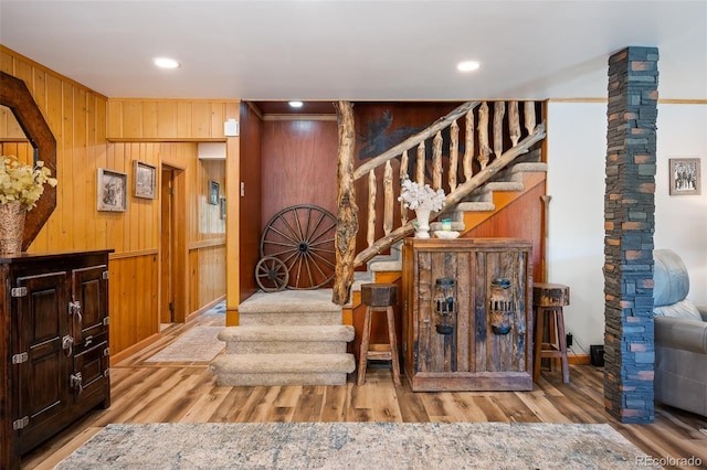 115 Lions Gate Dr, Winter Park, CO 80482 - stairs with wood finished floors, wooden walls, and recessed lighting