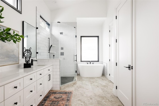 bathroom featuring vanity and plus walk in shower