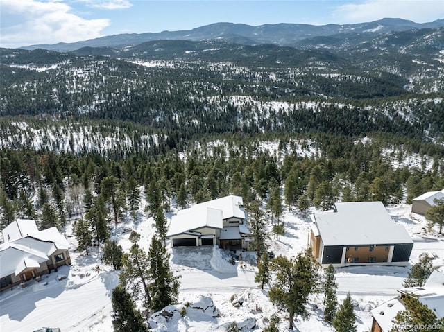 snowy aerial view featuring a mountain view