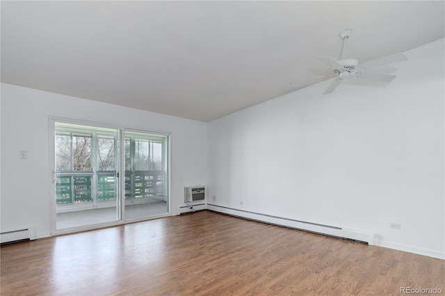 empty room with a baseboard radiator, wood finished floors, a ceiling fan, lofted ceiling, and a wall unit AC