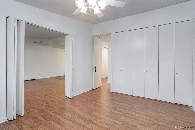 unfurnished bedroom featuring light wood-style floors, baseboards, and ceiling fan