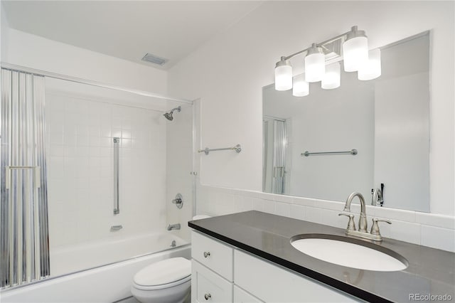 bathroom featuring toilet, shower / bathtub combination, and vanity