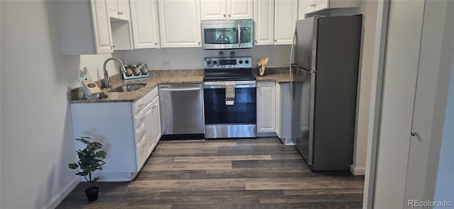 755 S Alton Way Unit 9D, Denver, CO 80247 - kitchen featuring appliances with stainless steel finishes, dark wood-type flooring, dark stone countertops, and white cabinets