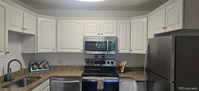 755 S Alton Way Unit 9D, Denver, CO 80247 - kitchen featuring stainless steel appliances, white cabinets, and dark stone counters