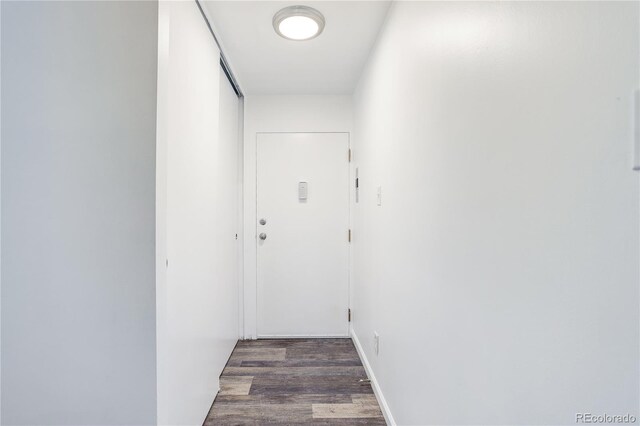 755 S Alton Way Unit 9D, Denver, CO 80247 - hallway featuring wood finished floors
