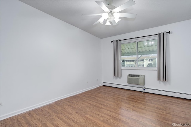 755 S Alton Way Unit 9D, Denver, CO 80247 - unfurnished room featuring wood finished floors, a ceiling fan, a wall unit AC, a baseboard heating unit, and vaulted ceiling