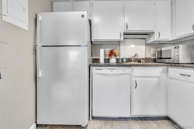 kitchen featuring white cabinets, light wood-type flooring, white appliances, and sink