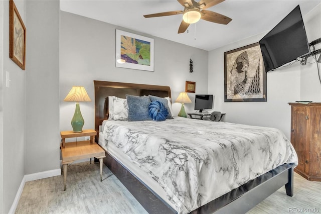 bedroom featuring hardwood / wood-style flooring and ceiling fan