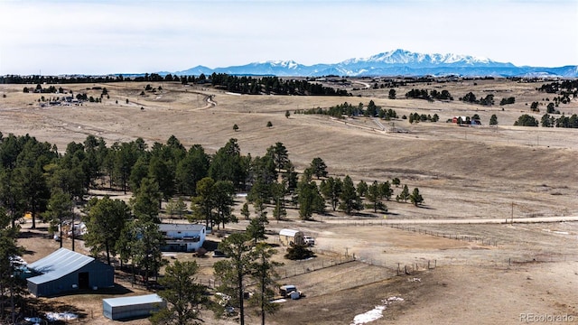 drone / aerial view with a rural view and a mountain view