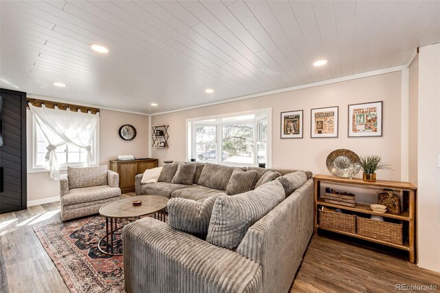 living room featuring wood ceiling, recessed lighting, wood finished floors, and ornamental molding