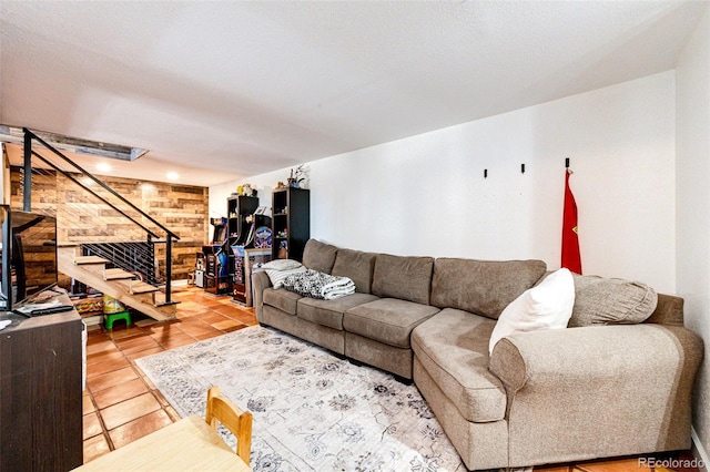 living area with light tile patterned floors and stairs