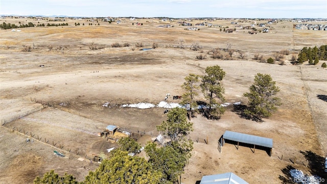 birds eye view of property featuring a desert view and a rural view