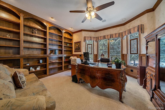 home office featuring light carpet, ceiling fan, and ornamental molding