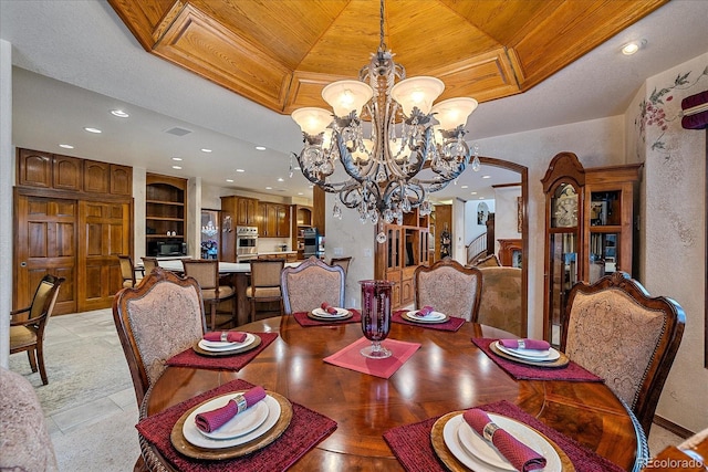 tiled dining area featuring a chandelier and wooden ceiling