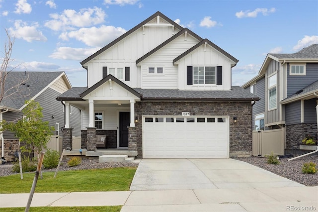 craftsman house featuring a garage and a front yard