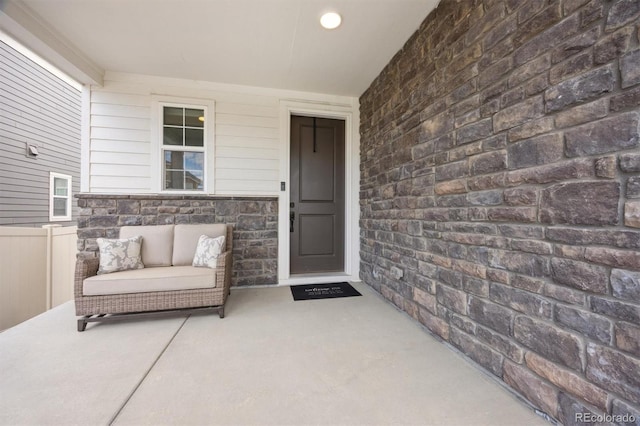 doorway to property featuring a patio area