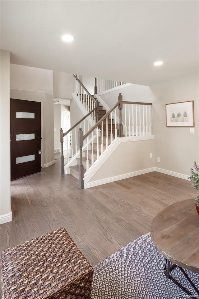 1772 Eisenhower, Louisville, CO 80027 - foyer featuring wood finished floors, stairs, baseboards, and recessed lighting