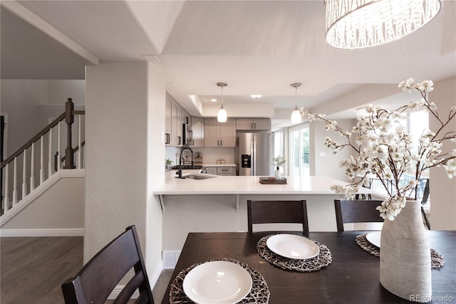 1772 Eisenhower, Louisville, CO 80027 - dining space with dark wood-type flooring, baseboards, and stairs