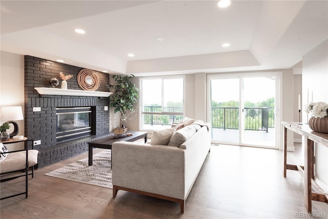 1772 Eisenhower, Louisville, CO 80027 - living room with a brick fireplace, wood finished floors, and recessed lighting