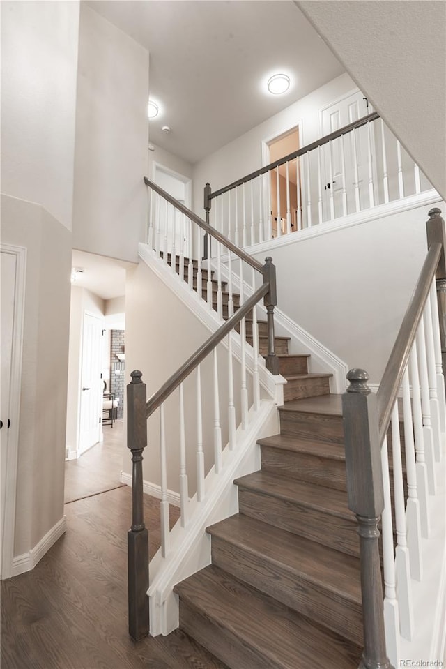 1772 Eisenhower, Louisville, CO 80027 - staircase with wood finished floors, baseboards, and a towering ceiling