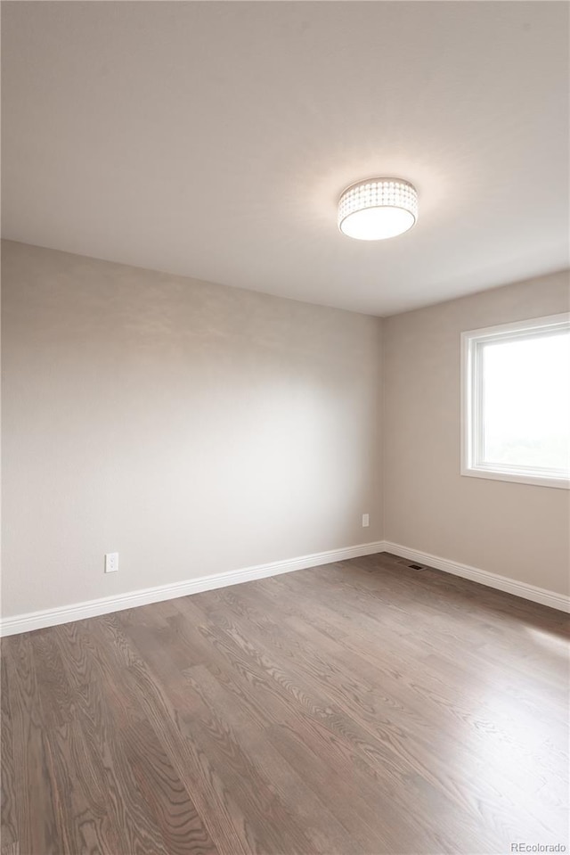1772 Eisenhower, Louisville, CO 80027 - unfurnished room featuring dark wood finished floors and baseboards