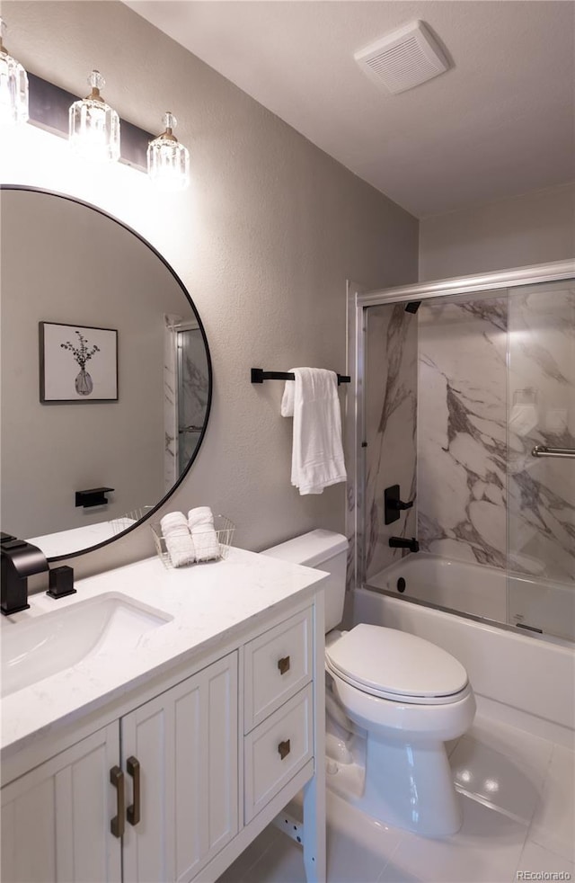 1772 Eisenhower, Louisville, CO 80027 - full bath with toilet, vanity, bath / shower combo with glass door, and a textured wall