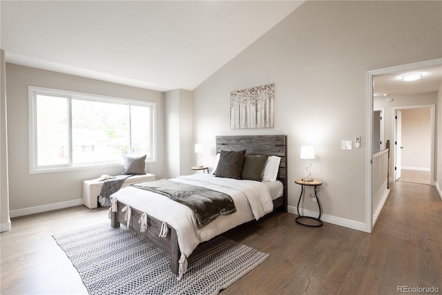 1772 Eisenhower, Louisville, CO 80027 - bedroom with baseboards, wood finished floors, and vaulted ceiling