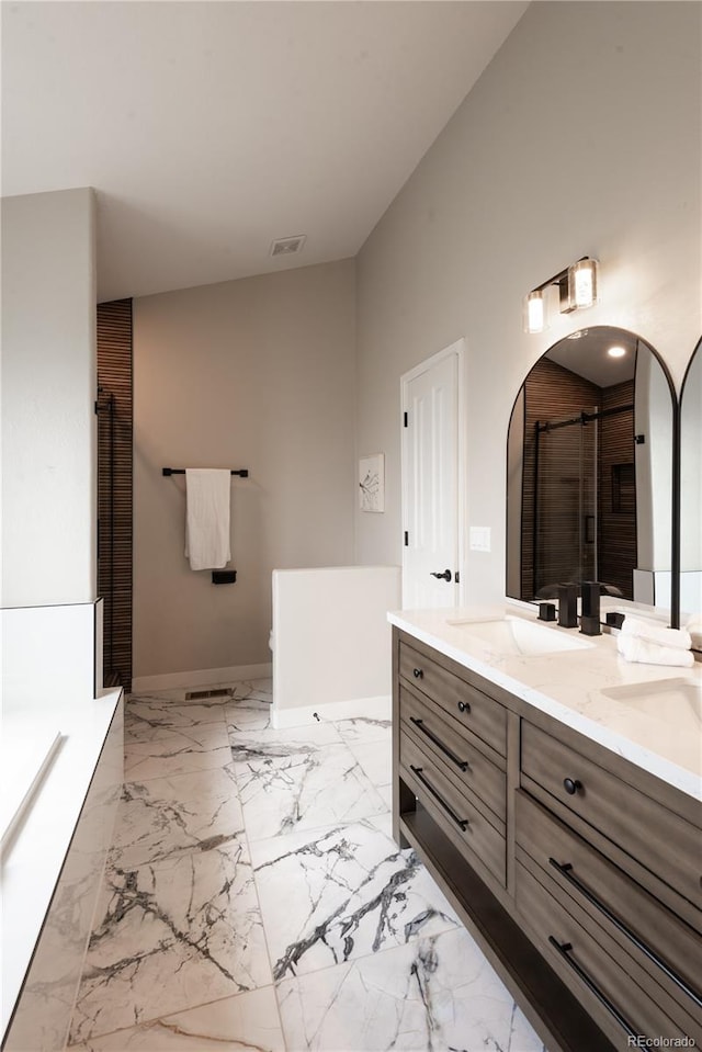 1772 Eisenhower, Louisville, CO 80027 - bathroom featuring double vanity, a tub, baseboards, vaulted ceiling, and a shower with shower door