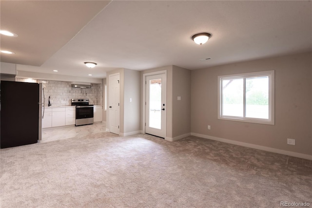 1772 Eisenhower, Louisville, CO 80027 - unfurnished living room with light carpet, baseboards, and recessed lighting