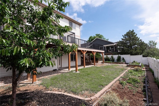 1772 Eisenhower, Louisville, CO 80027 - view of yard featuring a deck and a vegetable garden