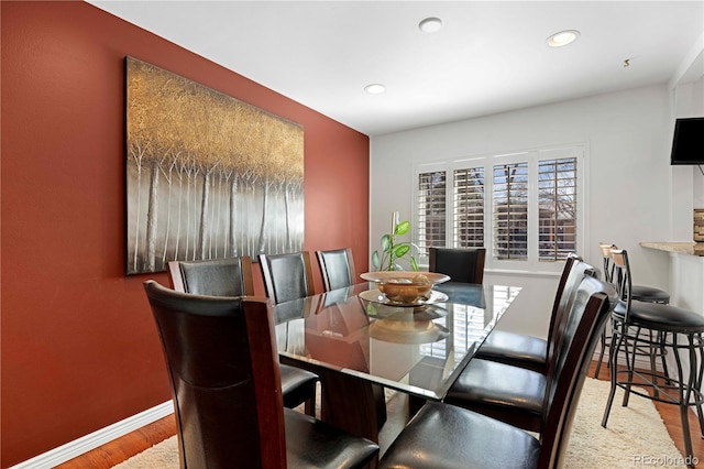 dining room featuring recessed lighting, baseboards, and wood finished floors