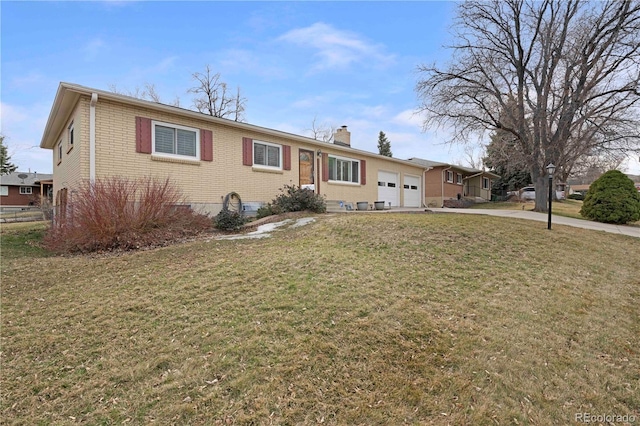 ranch-style house with driveway, a front lawn, a garage, brick siding, and a chimney